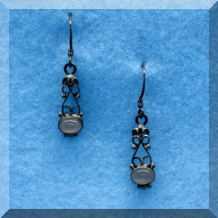 J47. Sterling silver scroll drop earrings with pink stone - $16